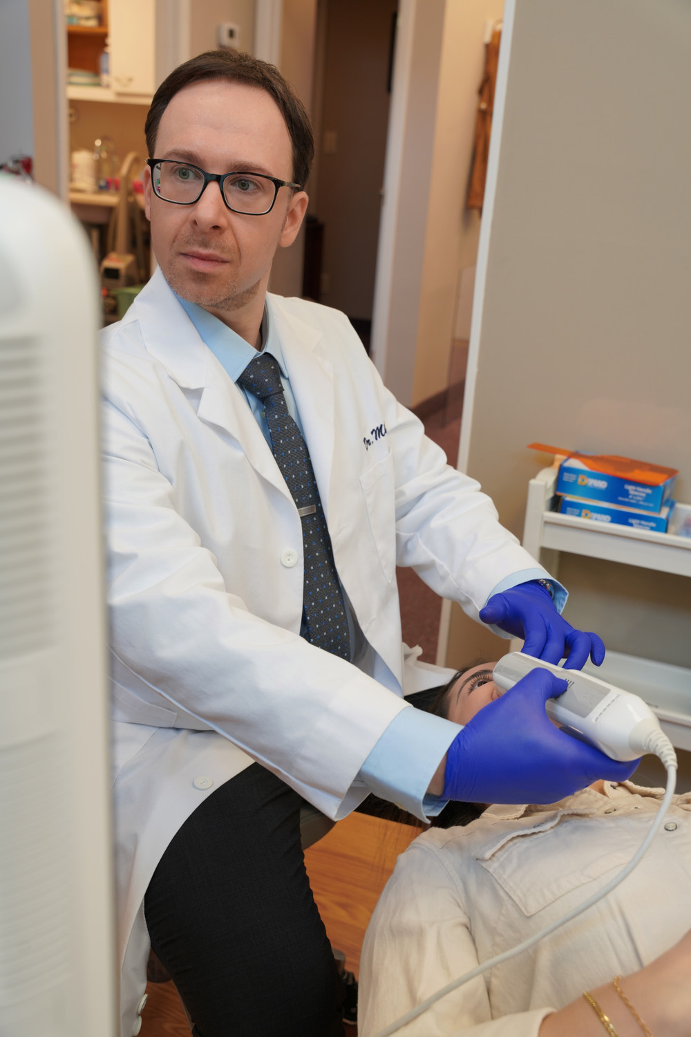 Dr. Miller with a patient at Long Island Braces