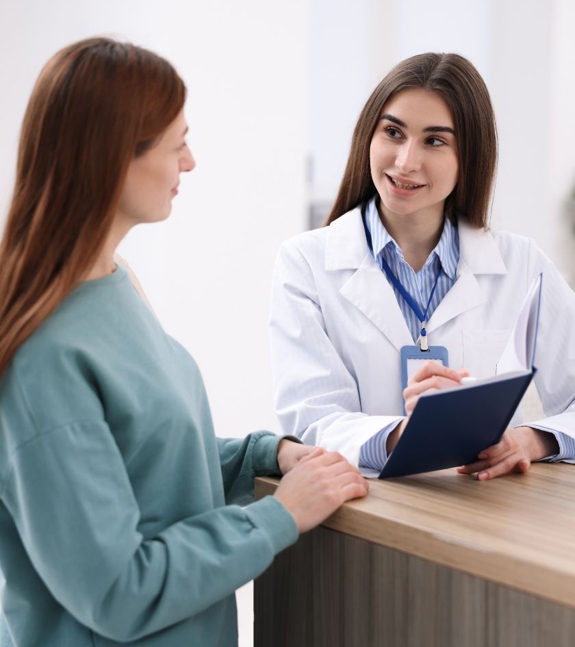 Dr. Miller reviewing paperwork with a new patient at Braces Island